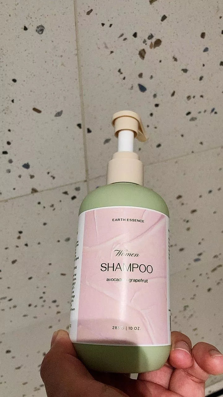 A satisfied customer with our eco-luxury shampoo bottle in hand, highlighting the premium quality and simple, honest beauty of the product. Their glowing expression shows the confidence that comes from using pure, effective ingredients